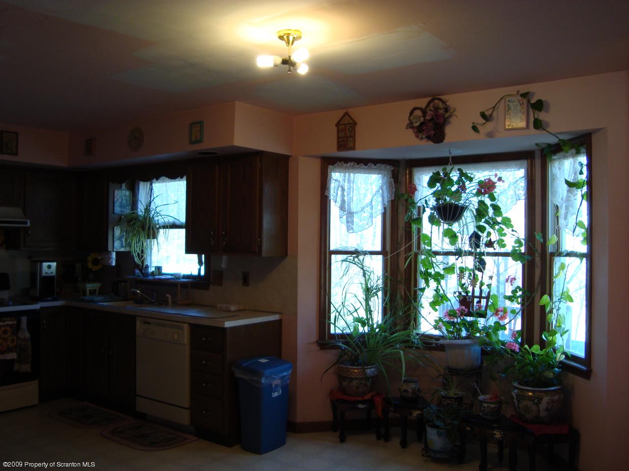 228 Winona Road Mount Pocono, PA 18344 - Photo 6 of 13 a kitchen with a window and cabinets