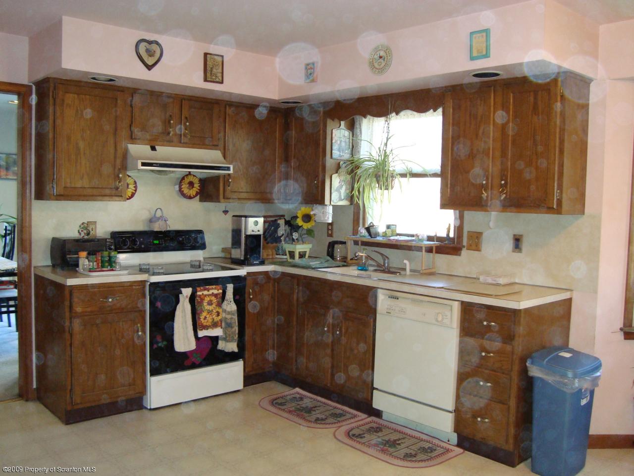 228 Winona Road Mount Pocono, PA 18344 - Photo 7 of 13 a kitchen with a sink cabinets and window