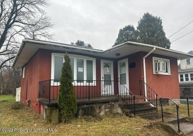 410 Riley Street Old Forge, PA 18518 - Photo 1 of 11 a front view of a house with garden