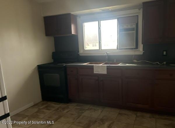 410 Riley Street Old Forge, PA 18518 - Photo 10 of 11 a bathroom with a sink and a mirror