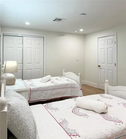 a bedroom with a bed and a couch