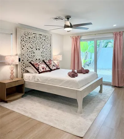 a living room with a bed furniture and a window