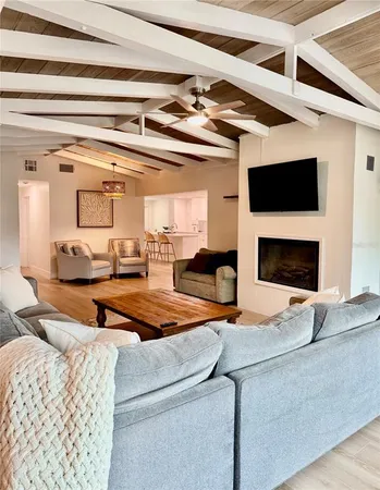 a outdoor living space with furniture and a flat screen tv