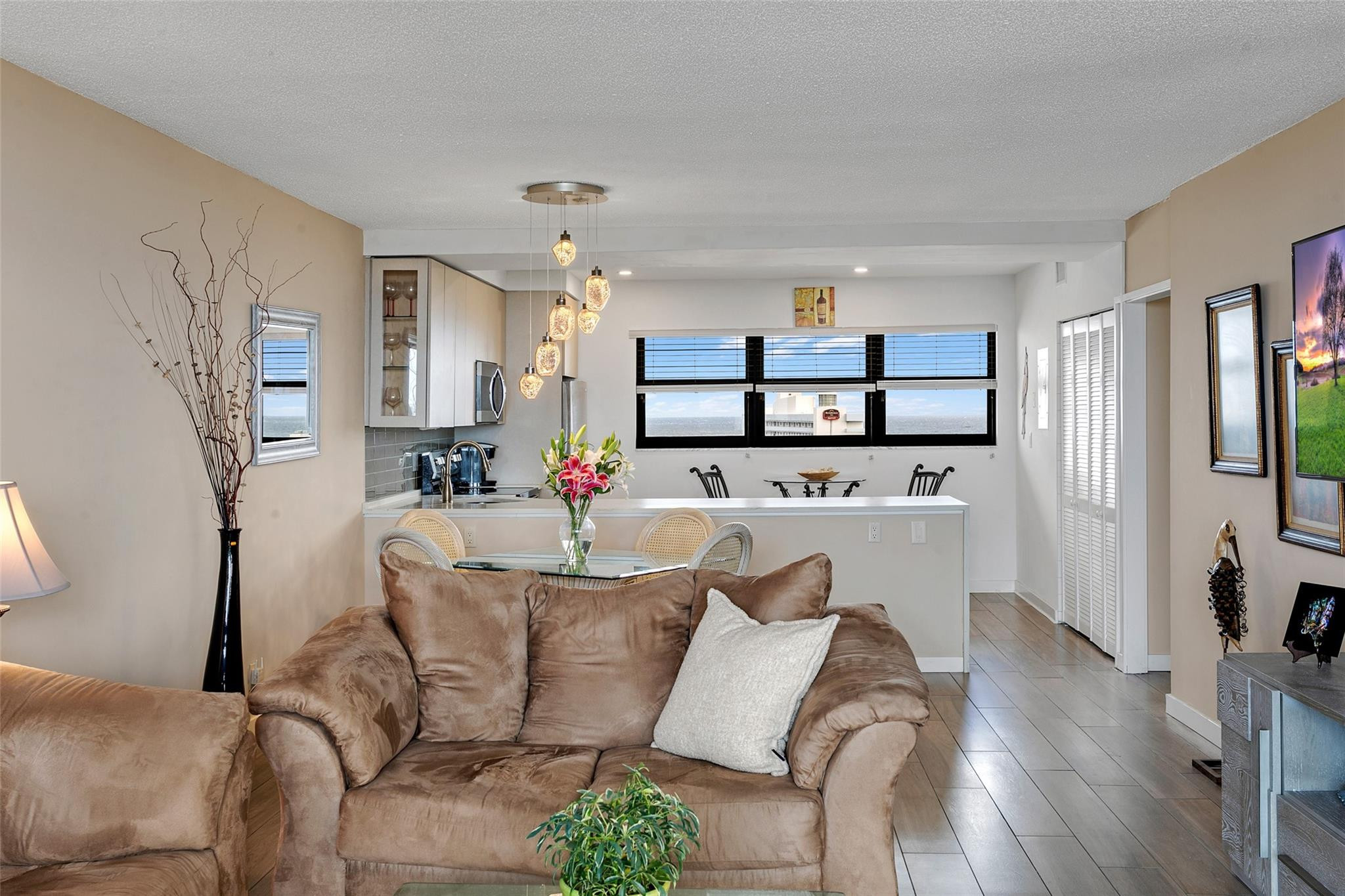1401 North Riverside Drive, Unit PH 1502 Pompano Beach, FL 33062 - Photo 12 of 32 a living room with furniture and a wooden floor