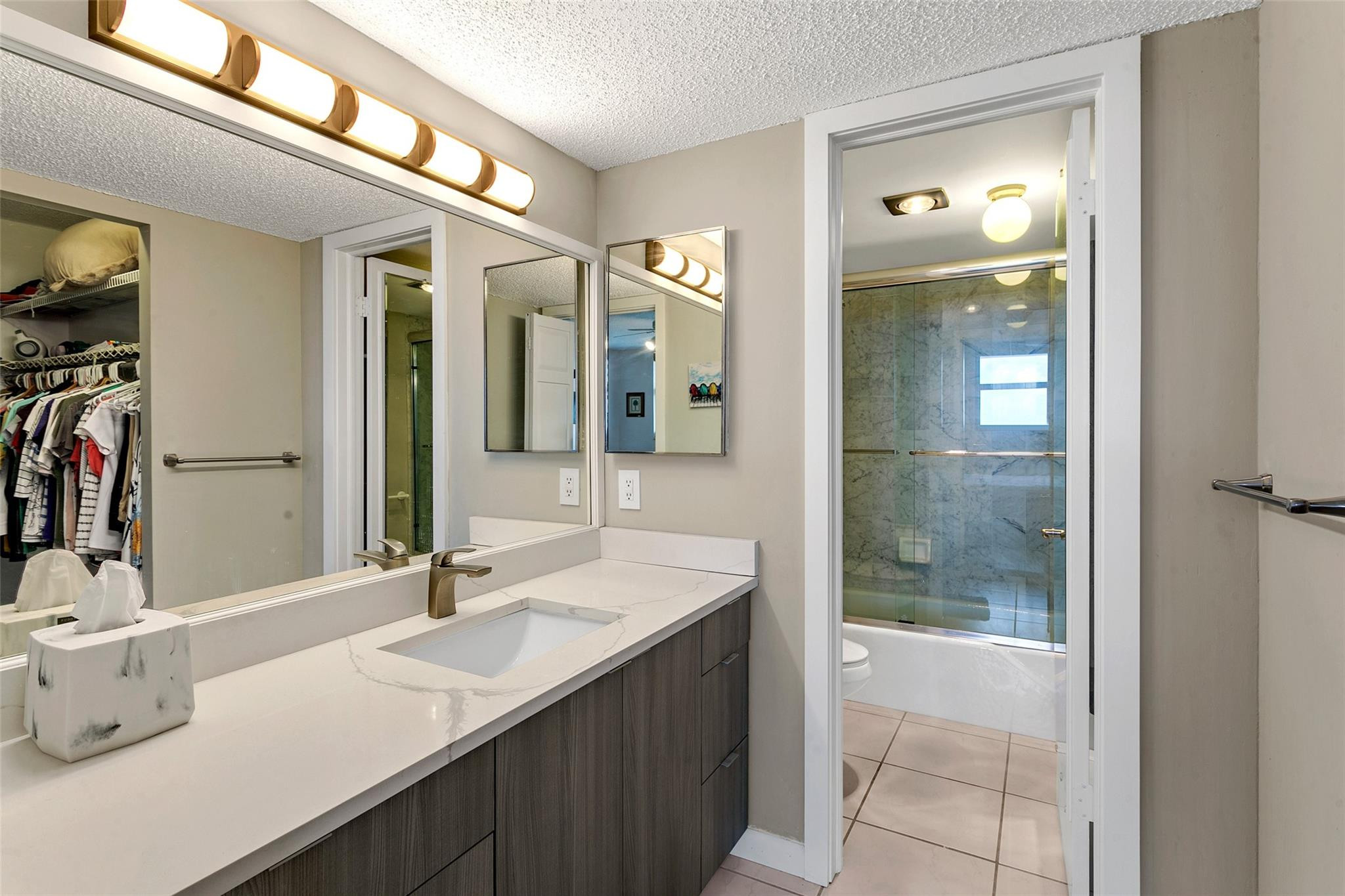 1401 North Riverside Drive, Unit PH 1502 Pompano Beach, FL 33062 - Photo 17 of 32 a bathroom with a sink and a mirror