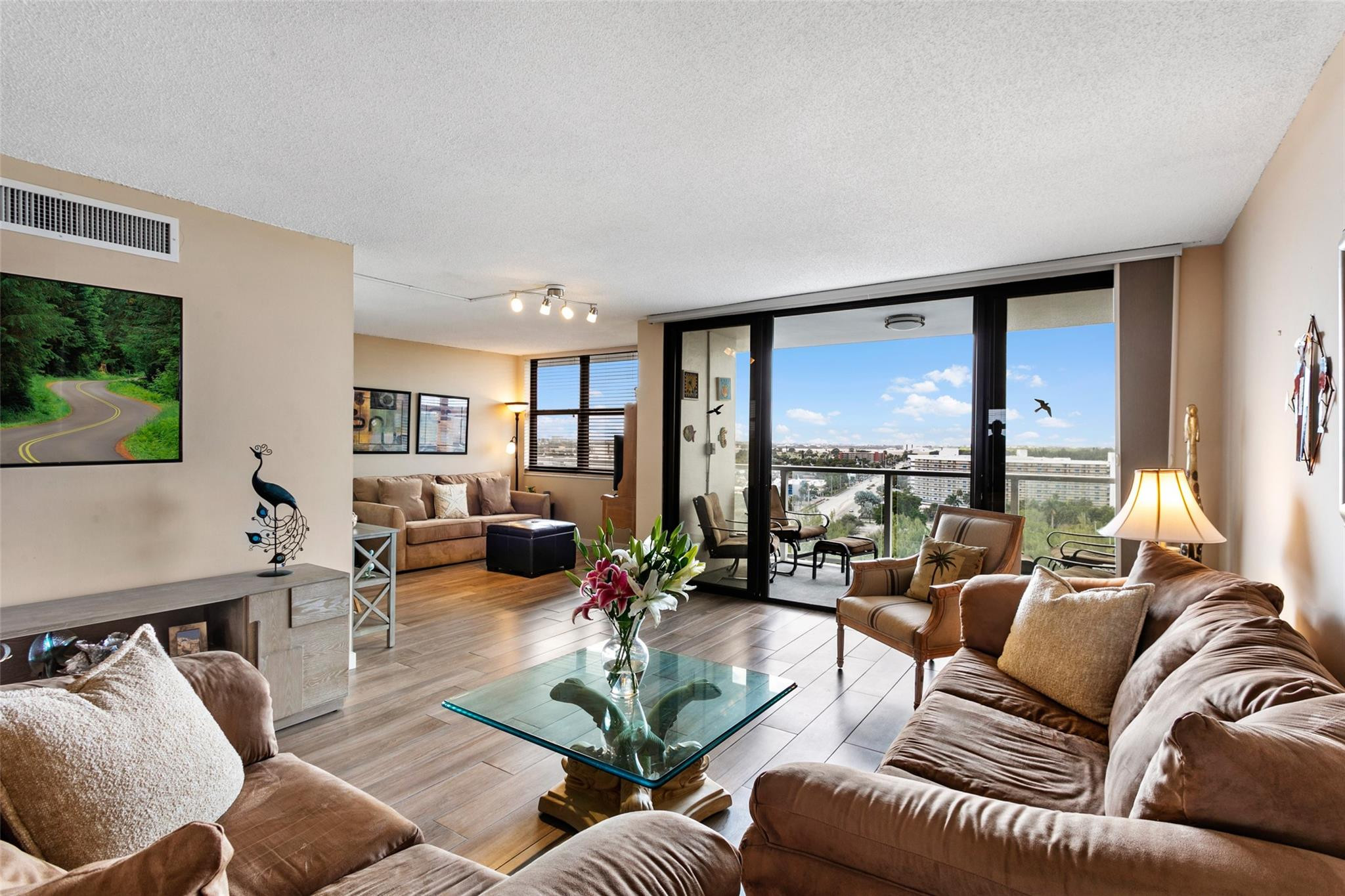1401 North Riverside Drive, Unit PH 1502 Pompano Beach, FL 33062 - Photo 10 of 32 a living room with furniture and a large window