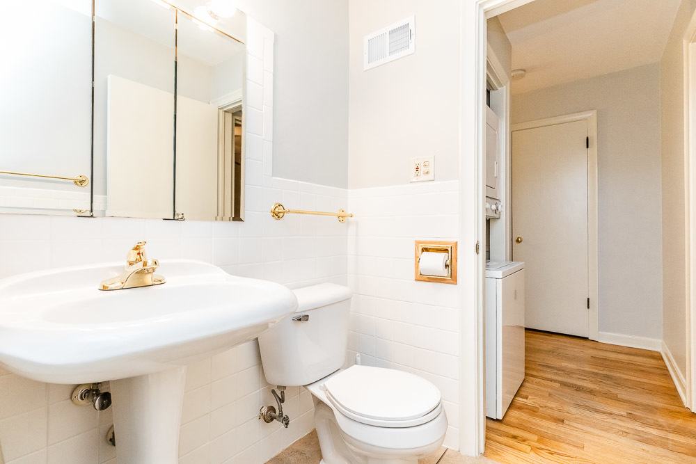 7221 Division Street, Unit 4 River Forest, IL 60305 - Photo 14 of 17 a bathroom with a sink a toilet and shower