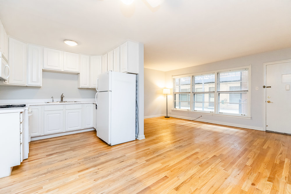 7221 Division Street, Unit 4 River Forest, IL 60305 - Photo 8 of 17 a kitchen with a refrigerator and wooden cabinets