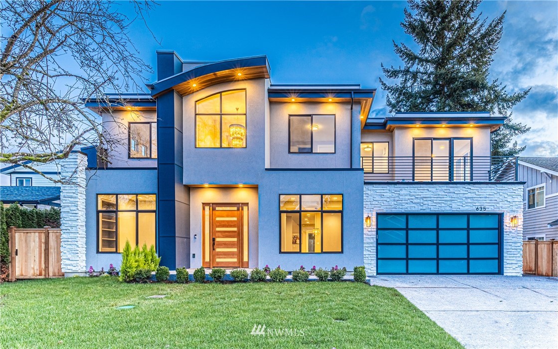 a front view of brick house with a yard