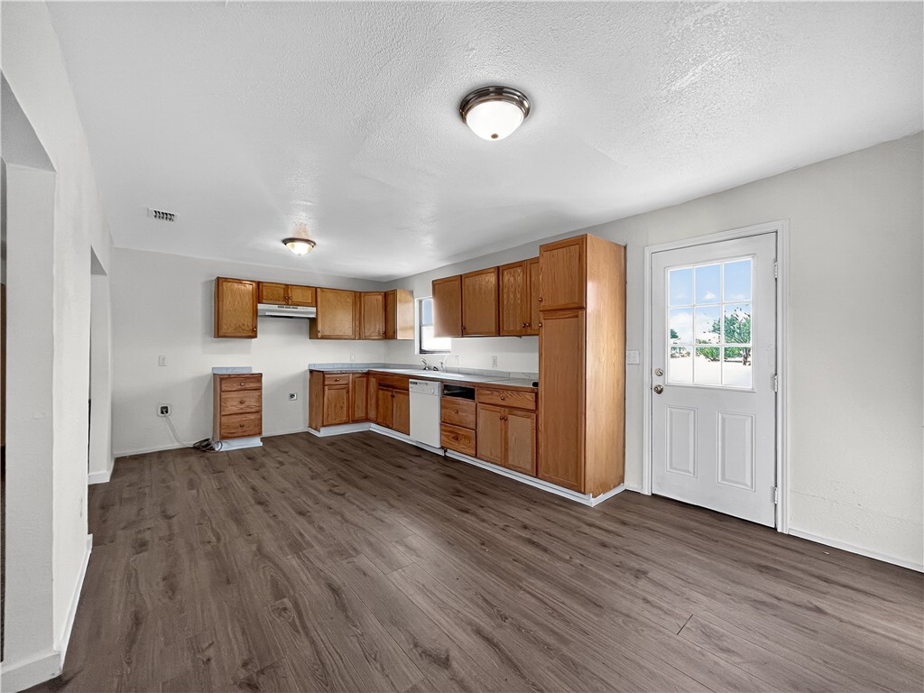4391 Piper Cub Street Robstown, TX 78380 - Photo 13 of 40 a kitchen with stainless steel appliances a refrigerator and a stove top oven