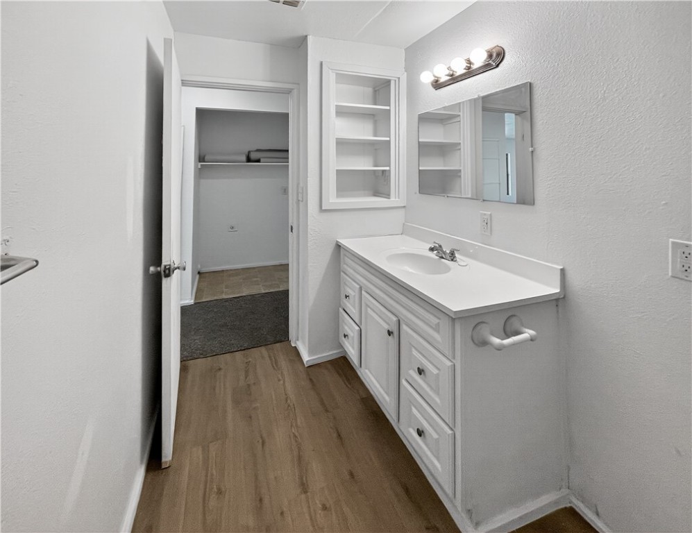 4391 Piper Cub Street Robstown, TX 78380 - Photo 30 of 40 a bathroom with a double vanity sink a mirror and a shower