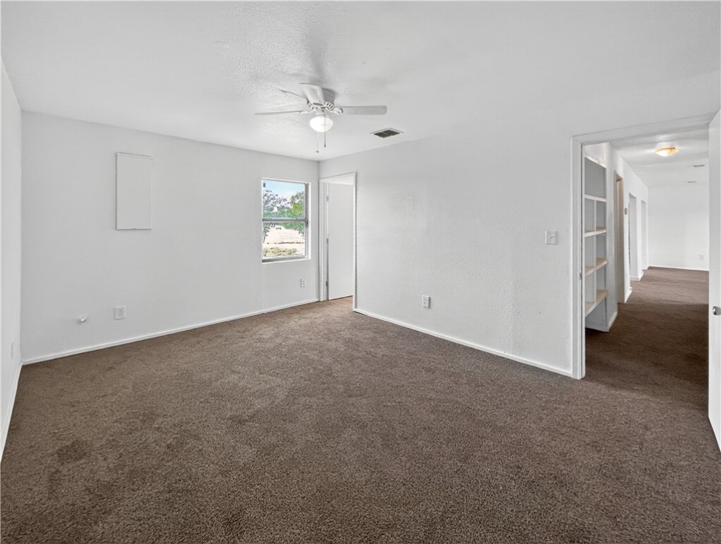 4391 Piper Cub Street Robstown, TX 78380 - Photo 32 of 40 a view of an empty room with a chandelier fan