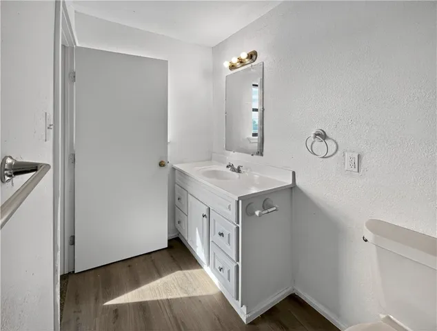 a spacious bathroom with a double vanity sink and mirror