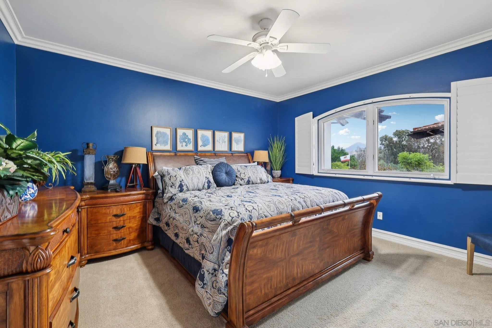 13371 Summit Circle Poway, CA 92064 - Photo 33 of 75 a bedroom with a large bed and a chandelier