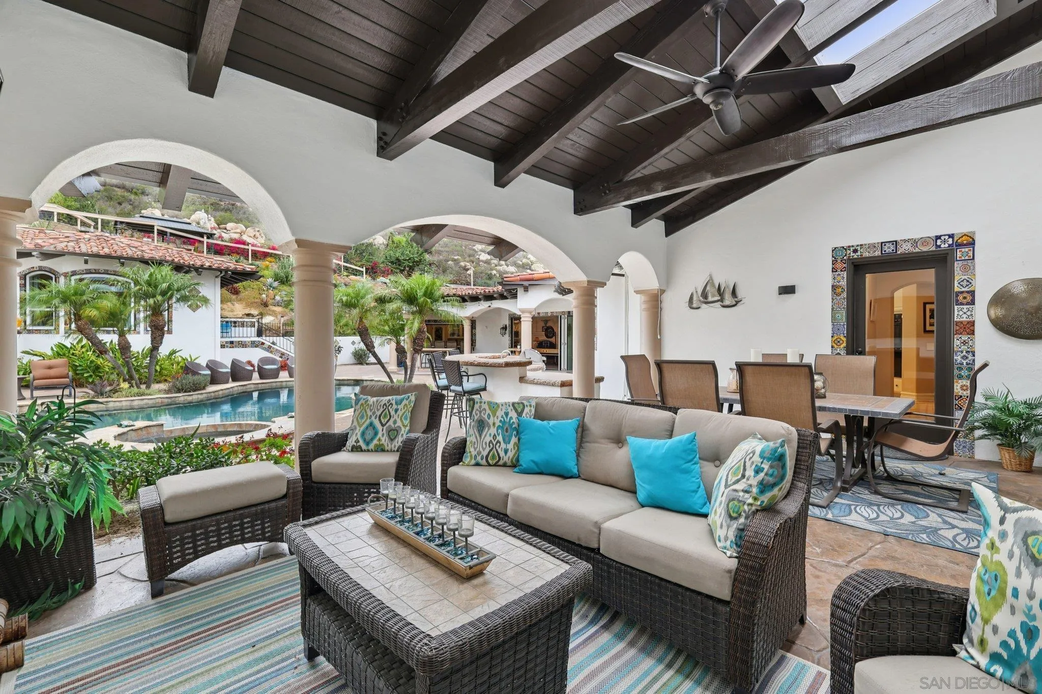 13371 Summit Circle Poway, CA 92064 - Photo 43 of 75 a living room with furniture a fireplace and a floor to ceiling window