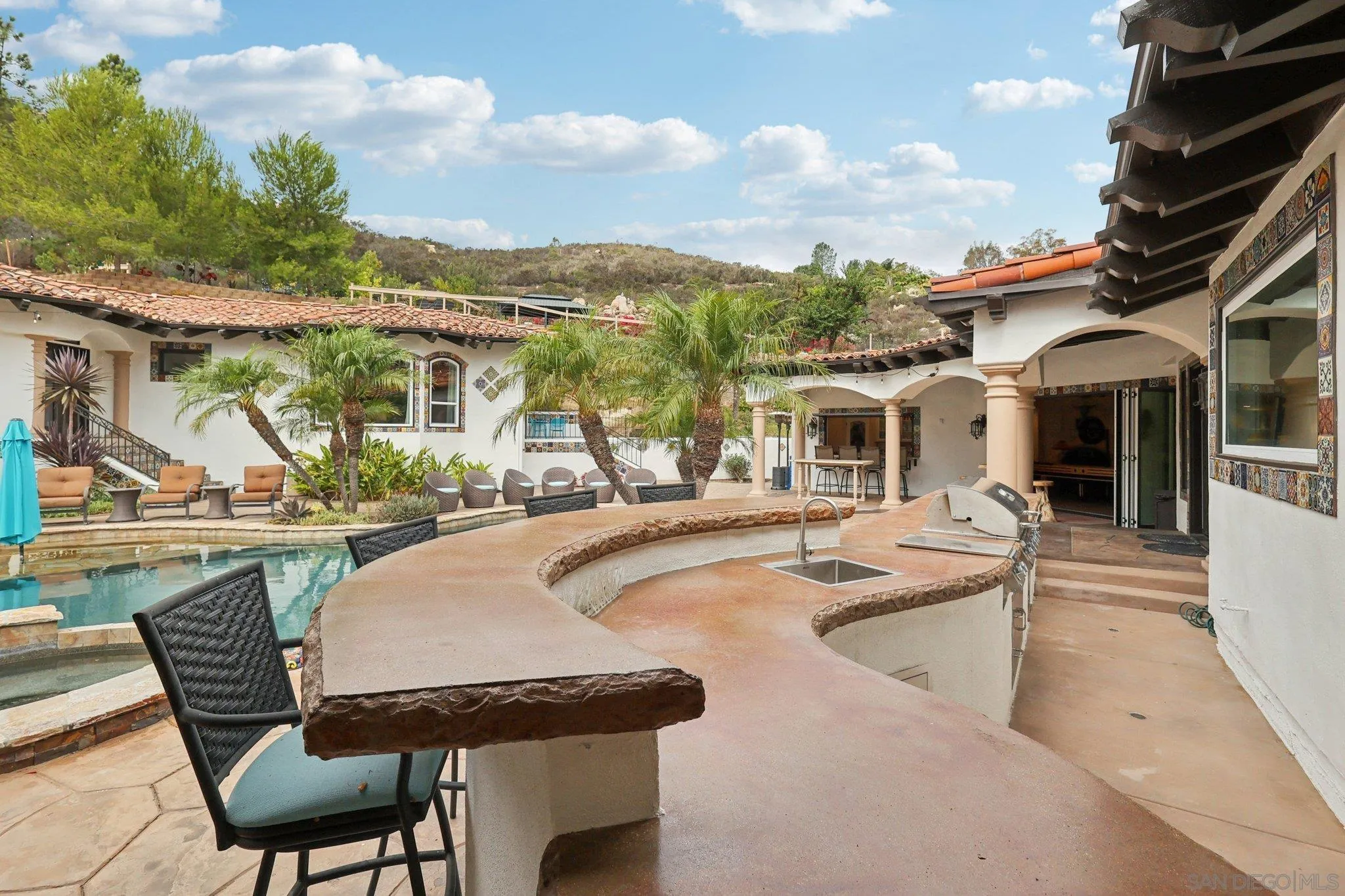 13371 Summit Circle Poway, CA 92064 - Photo 52 of 75 a view of a patio with swimming pool table and chairs