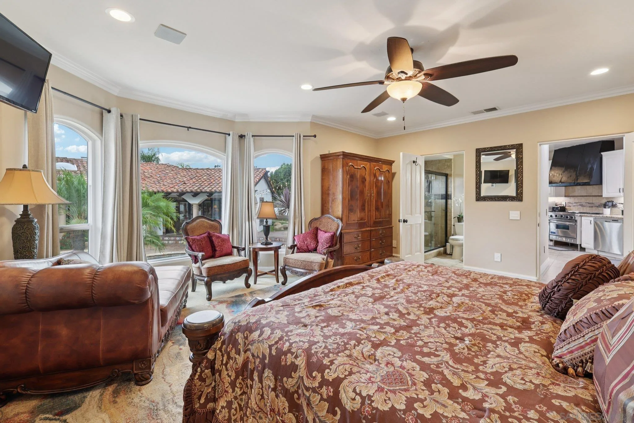 13371 Summit Circle Poway, CA 92064 - Photo 59 of 75 a bedroom with a bed a flat screen tv and a large window