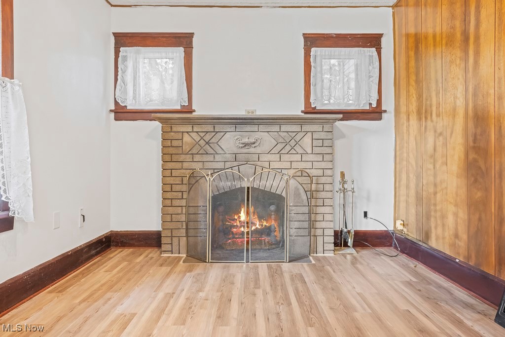 2725 Linwood Road Akron, OH 44312 - Photo 18 of 38 Room details featuring a brick fireplace and wood-type flooring