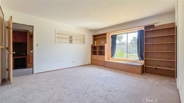 an empty room with a empty space and window