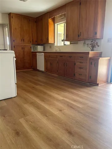 a room with a cabinets and a sink