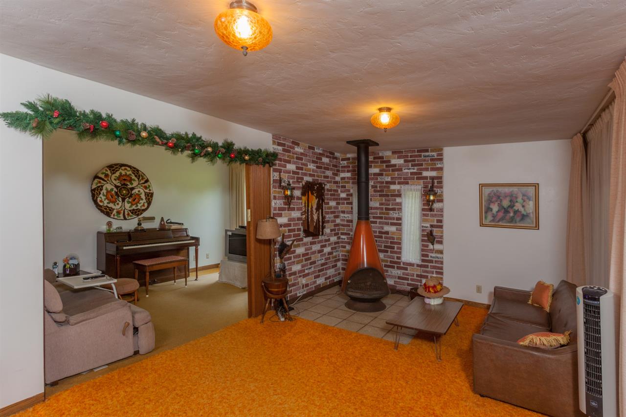 605 Kaupakalua Road Haiku, HI 96708 - Photo 14 of 30 a bedroom with furniture and a bed