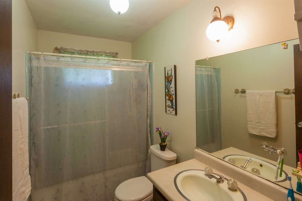 605 Kaupakalua Road Haiku, HI 96708 - Photo 19 of 30 a bathroom with a granite countertop sink toilet and shower