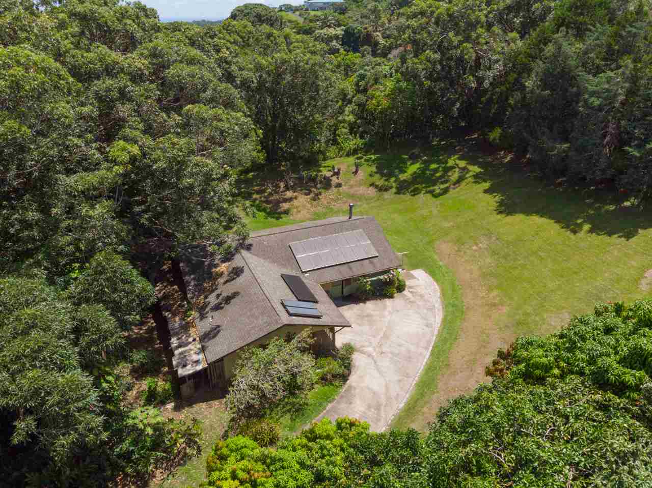 605 Kaupakalua Road Haiku, HI 96708 - Photo 6 of 30 an aerial view of a house with a yard and lake view