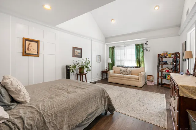 a bedroom with a bed and furniture