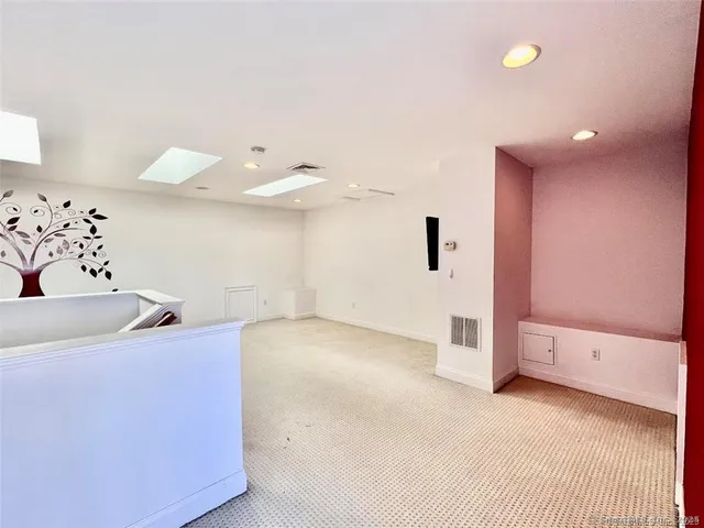 a view of a livingroom with a kitchen