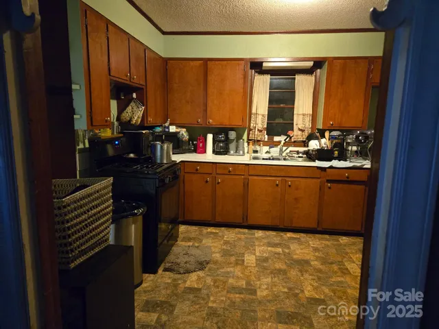 a kitchen with sink and window