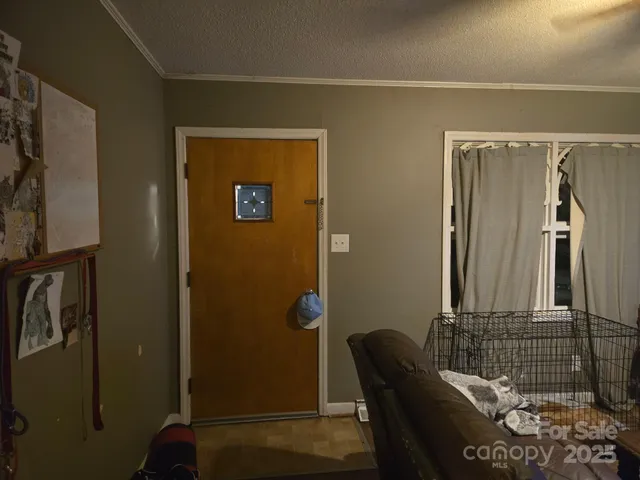 a view of a door and chair in a room