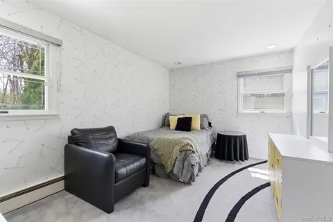 a bedroom with furniture and a window