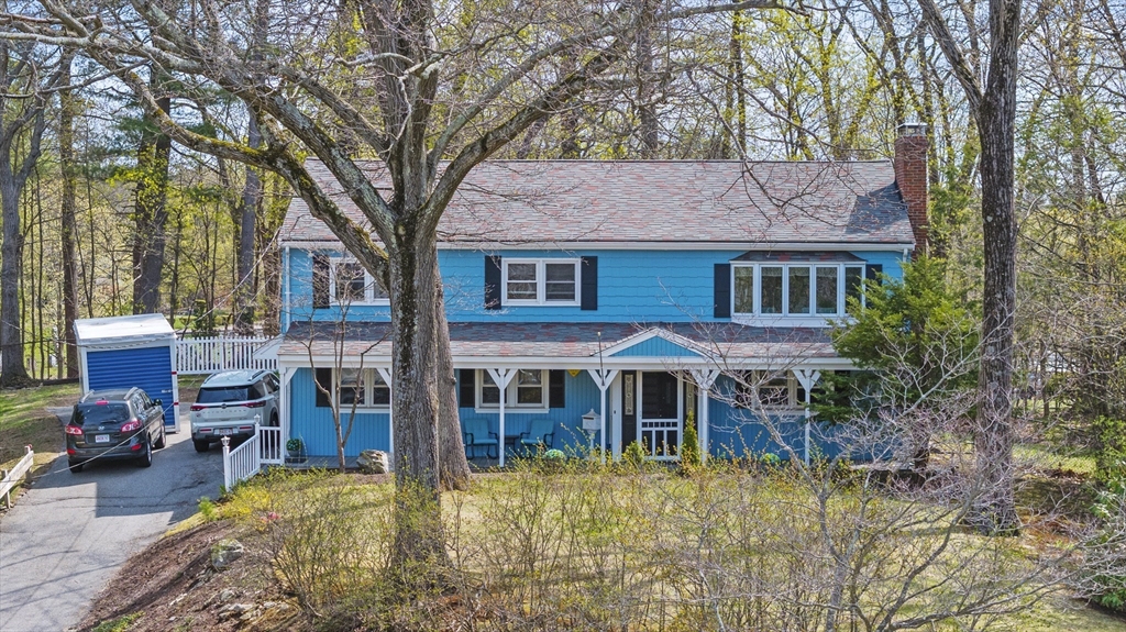 a view of a house with a yard and balcony