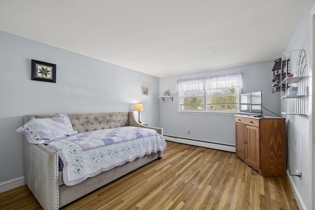 21 Reading Terrace Reading, MA 01867 - Photo 21 of 42 a living room with furniture and a dresser