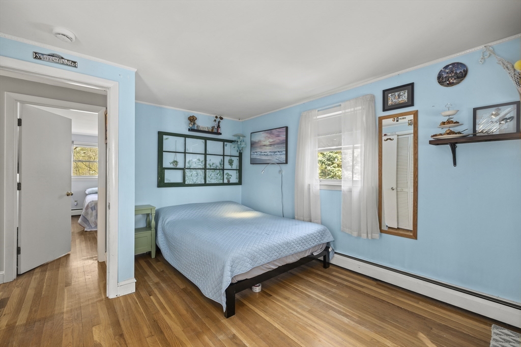 21 Reading Terrace Reading, MA 01867 - Photo 27 of 42 a bedroom with a bed and a window