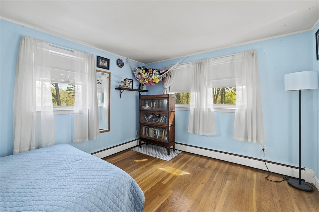 21 Reading Terrace Reading, MA 01867 - Photo 28 of 42 a bedroom with a bed and a window