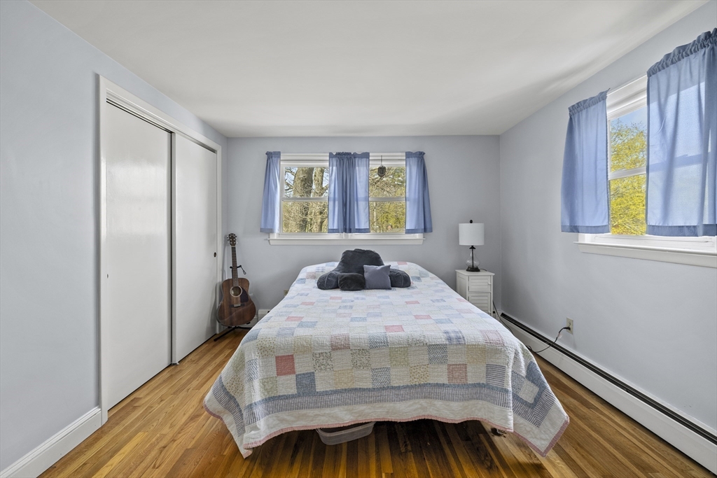 21 Reading Terrace Reading, MA 01867 - Photo 31 of 42 a bedroom with a bed and a window