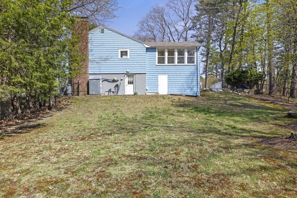 21 Reading Terrace Reading, MA 01867 - Photo 36 of 42 a brick house with a yard