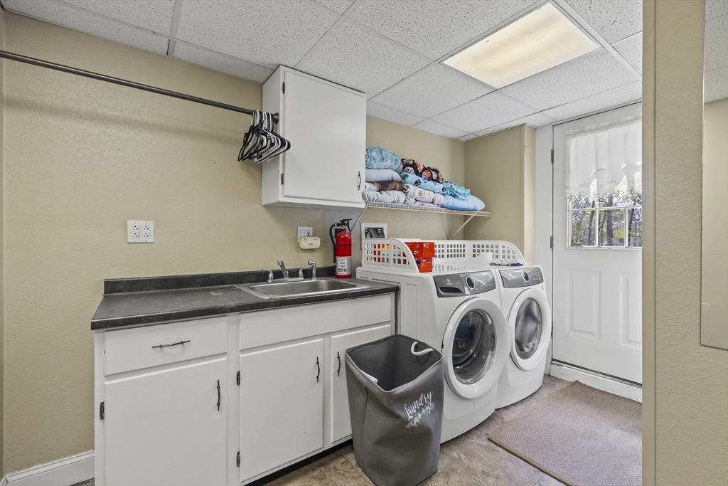 21 Reading Terrace Reading, MA 01867 - Photo 38 of 42 a utility room with sink dryer and washer