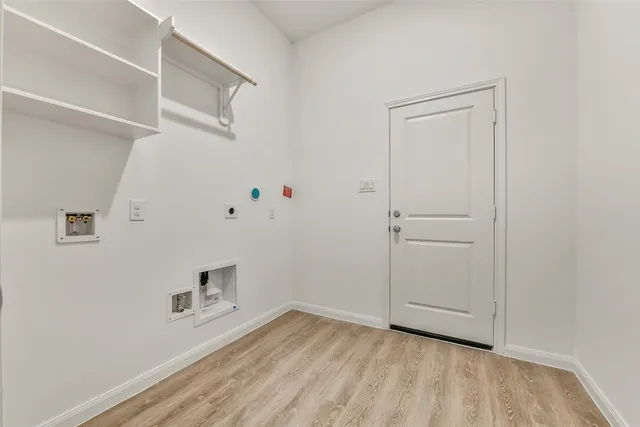 an empty room with a hardwood and wooden floor