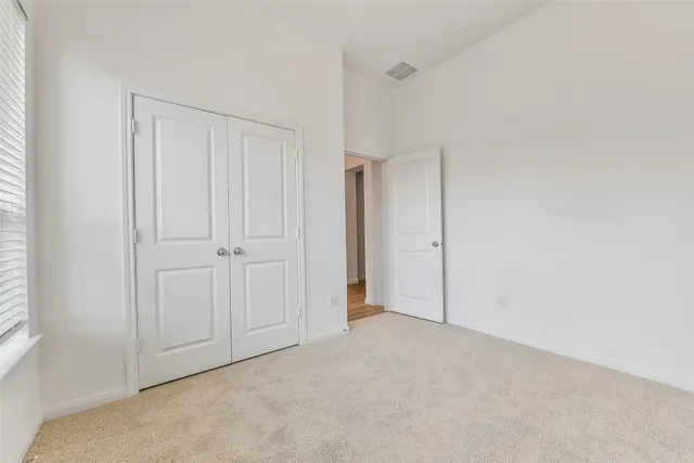 a view of a house with a yard and deck