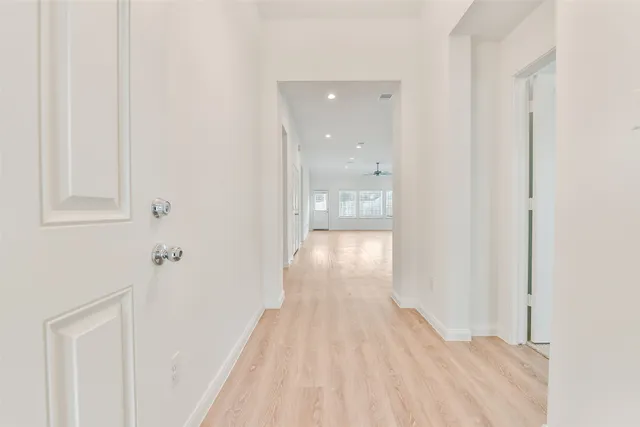 a view of a bathroom from a hallway