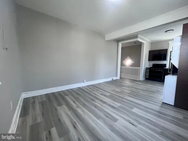 a view of livingroom with hardwood floor and hallway