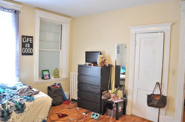 a bedroom with a bed and furniture