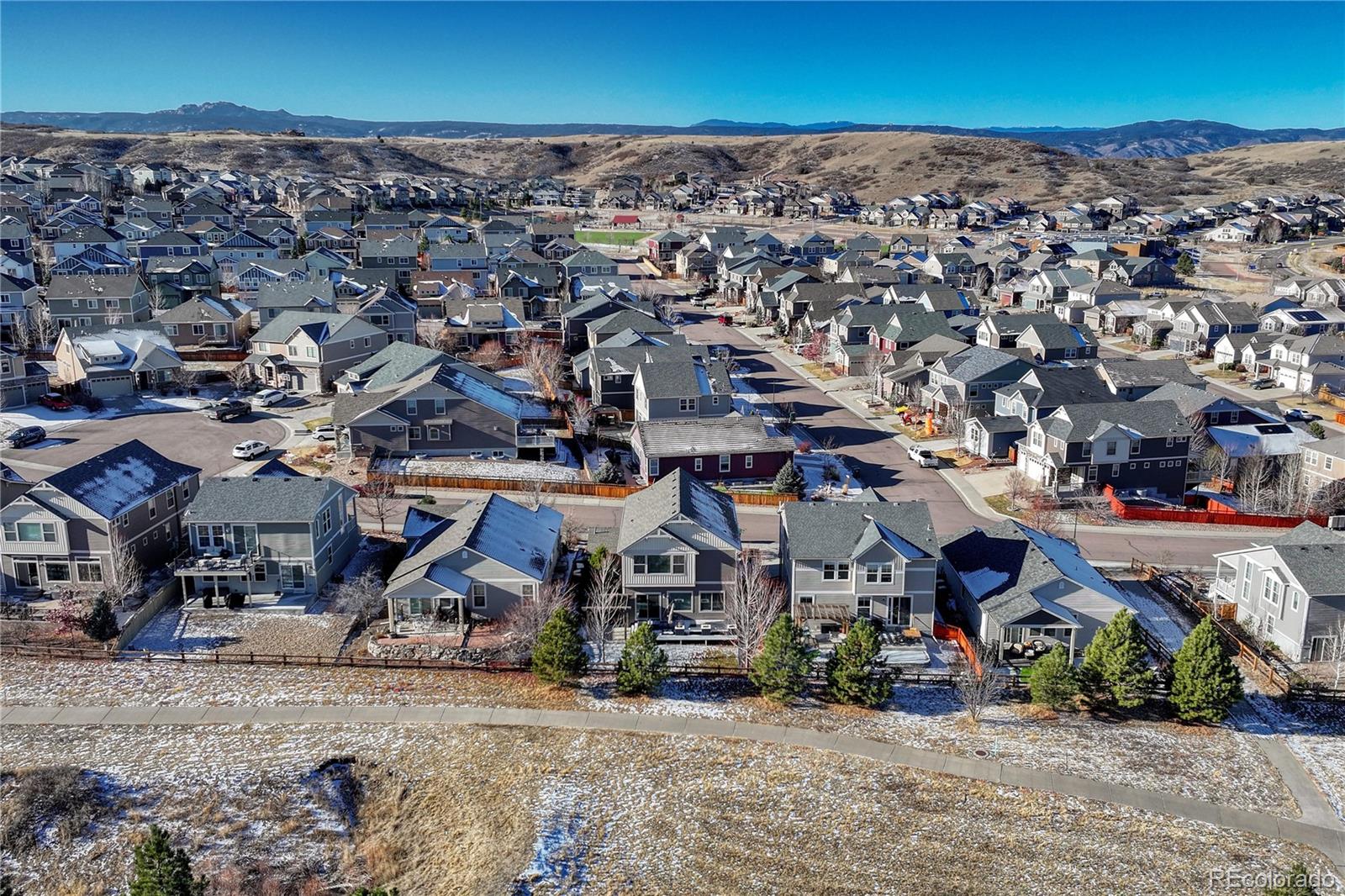 3359 Starry Night Loop Castle Rock, CO 80109 - Photo 2 of 47 an aerial view of a town with big trees