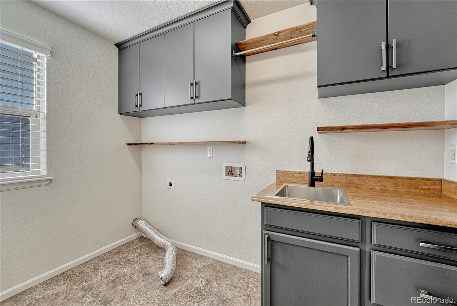 3359 Starry Night Loop Castle Rock, CO 80109 - Photo 27 of 47 a kitchen with cabinets appliances and a sink