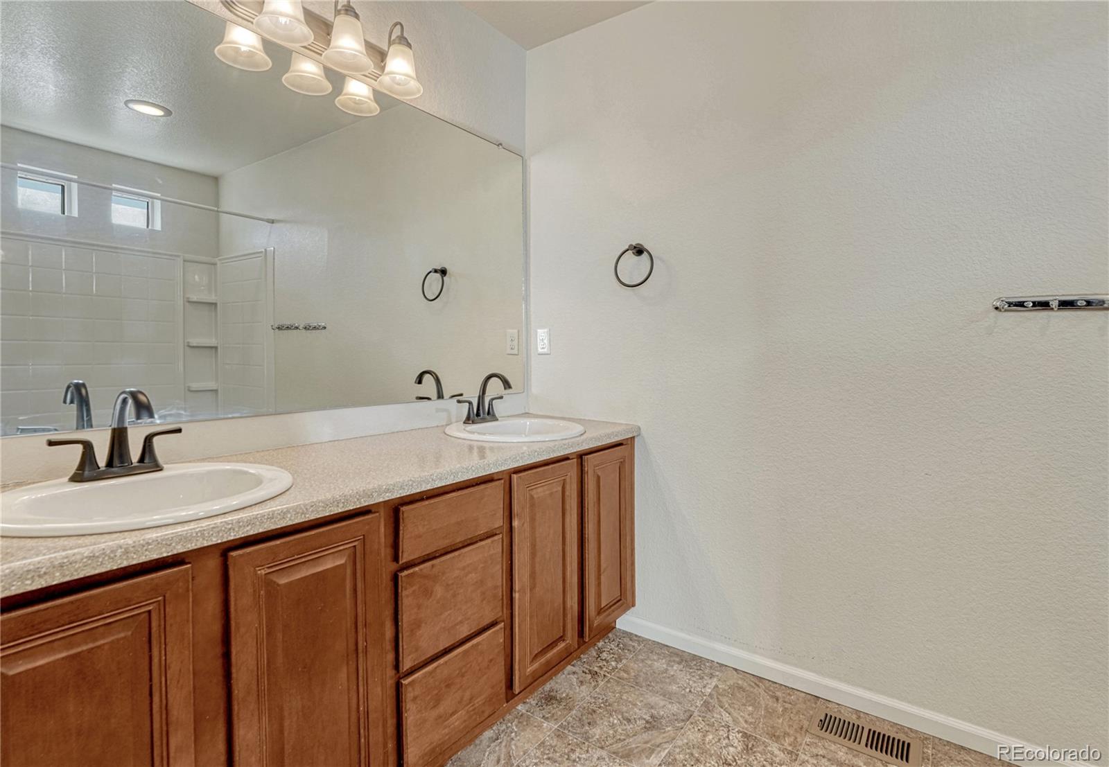 3359 Starry Night Loop Castle Rock, CO 80109 - Photo 34 of 47 a bathroom with a sink and a mirror
