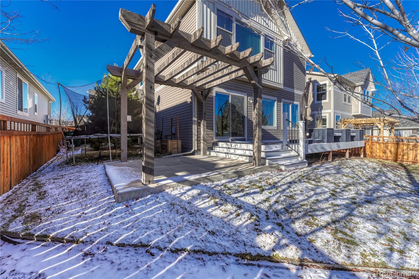 3359 Starry Night Loop Castle Rock, CO 80109 - Photo 44 of 47 a view of a building with a bench in a backyard