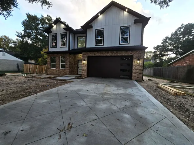 a backyard of a house with wooden fence