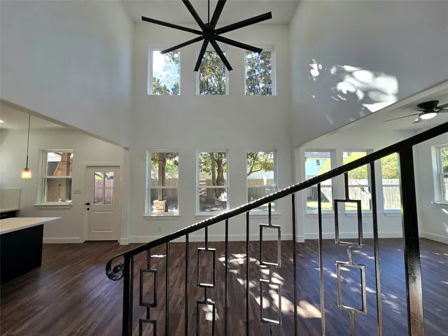 a view of room with a ceiling fan and window